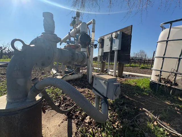 a view of a chairs and table in patio with a lake view