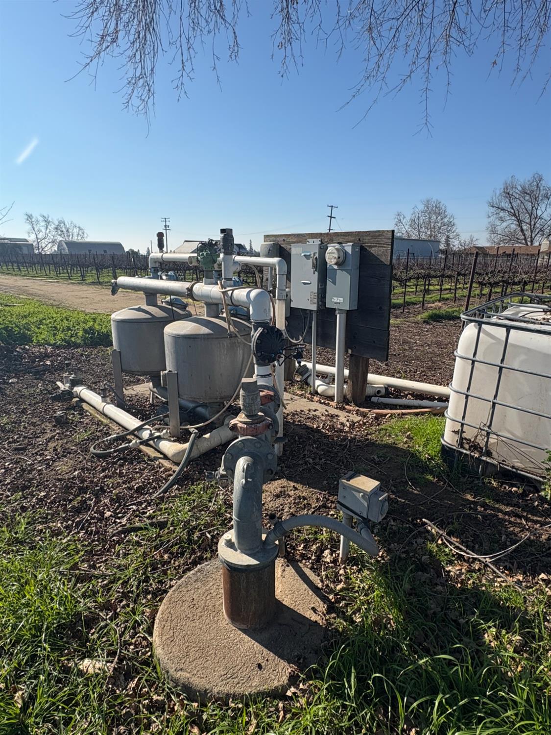 15910 North Locust Tree Road Lodi, CA 95240 - Photo 22 of 24 a view of a water fountain in a yard next to a lake