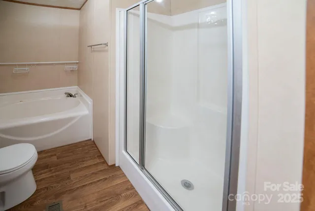 a bathroom with a toilet and a bathtub