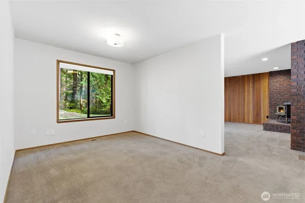 a view of a kitchen with a sink and cabinets