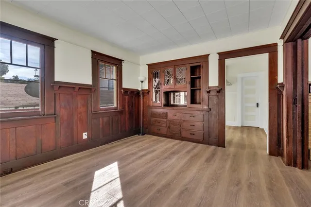 a kitchen with a sink window and cabinets
