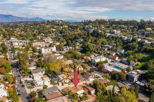 an aerial view of houses with outdoor space