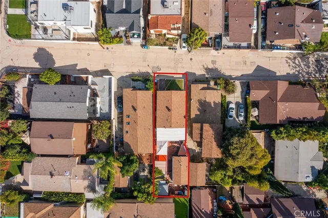 a aerial view of a house with a yard