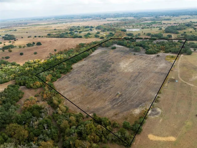an aerial view of beach and residential space