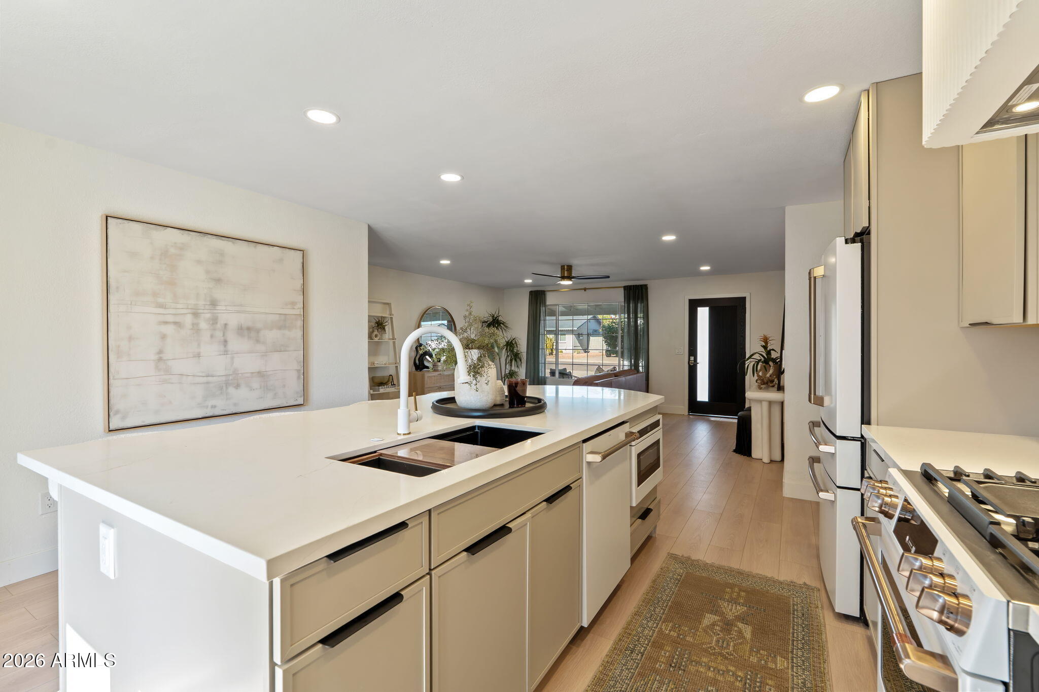 7255 East Coronado Road Scottsdale, AZ 85257 - Photo 14 of 55 a kitchen with stainless steel appliances granite countertop a stove and a sink