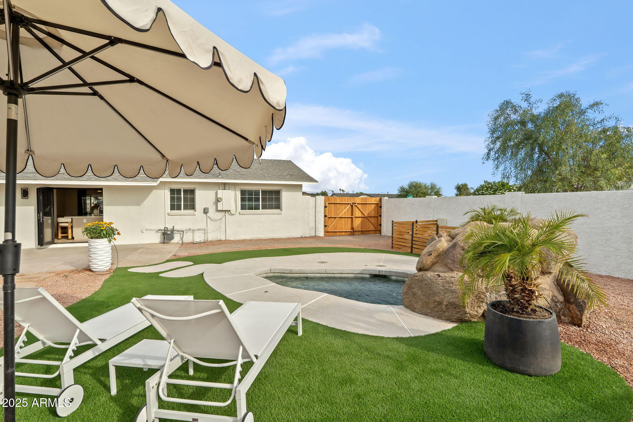 7255 East Coronado Road Scottsdale, AZ 85257 - Photo 35 of 55 a swimming pool with outdoor seating and yard