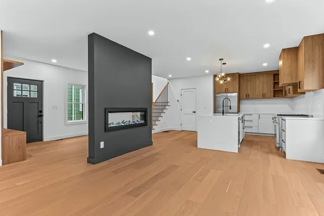 a kitchen with stainless steel appliances a refrigerator sink and microwave