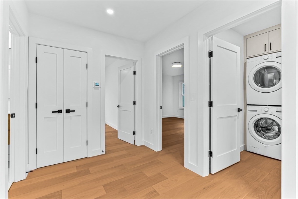 11 Bonner Avenue, Unit 2 Medford, MA 02155 - Photo 16 of 33 a view of a storage & utility room with washer and dryer