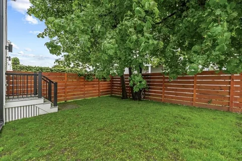 a view of a deck with a small yard