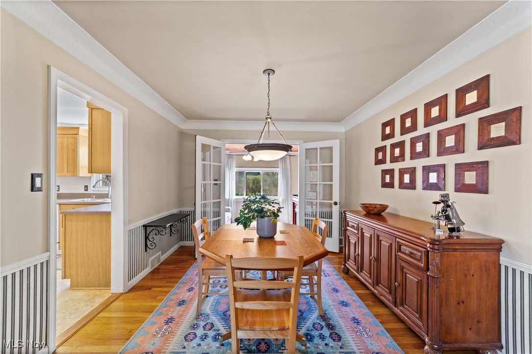 3826 Faversham Road Cleveland, OH 44118 - Photo 5 of 40 Dining area with ornamental molding, french doors, and wood finished floors