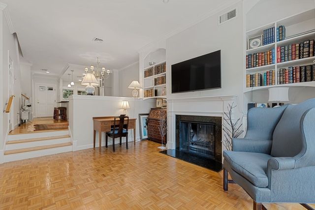 a living room with furniture fireplace and flat screen tv