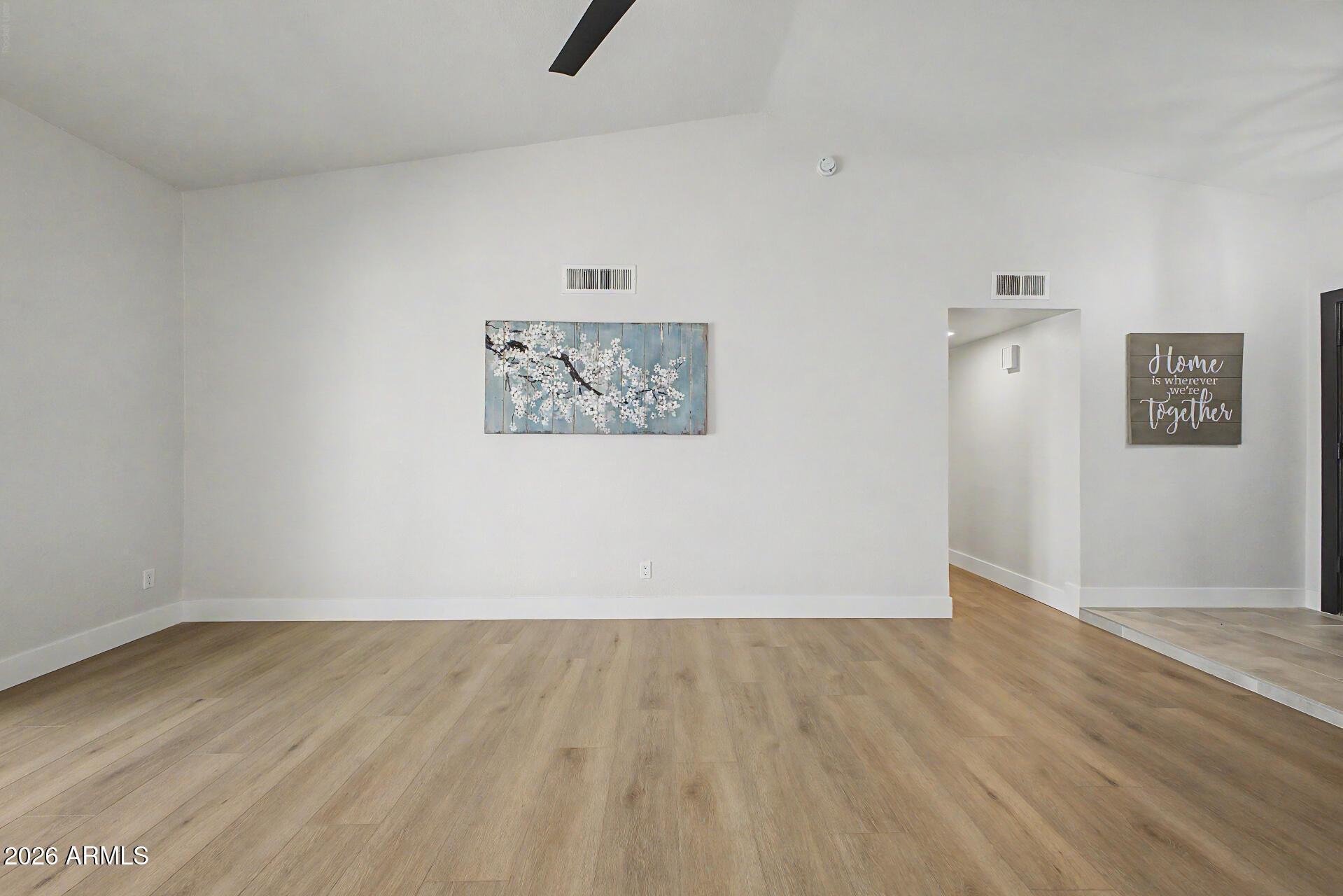 1009 West Pampa Avenue Mesa, AZ 85210 - Photo 13 of 31 an empty room with wooden floor and ceiling fan