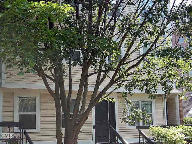 23 Highland Road Stamford, CT 06901 - Photo 1 of 1 a house with trees in front of it