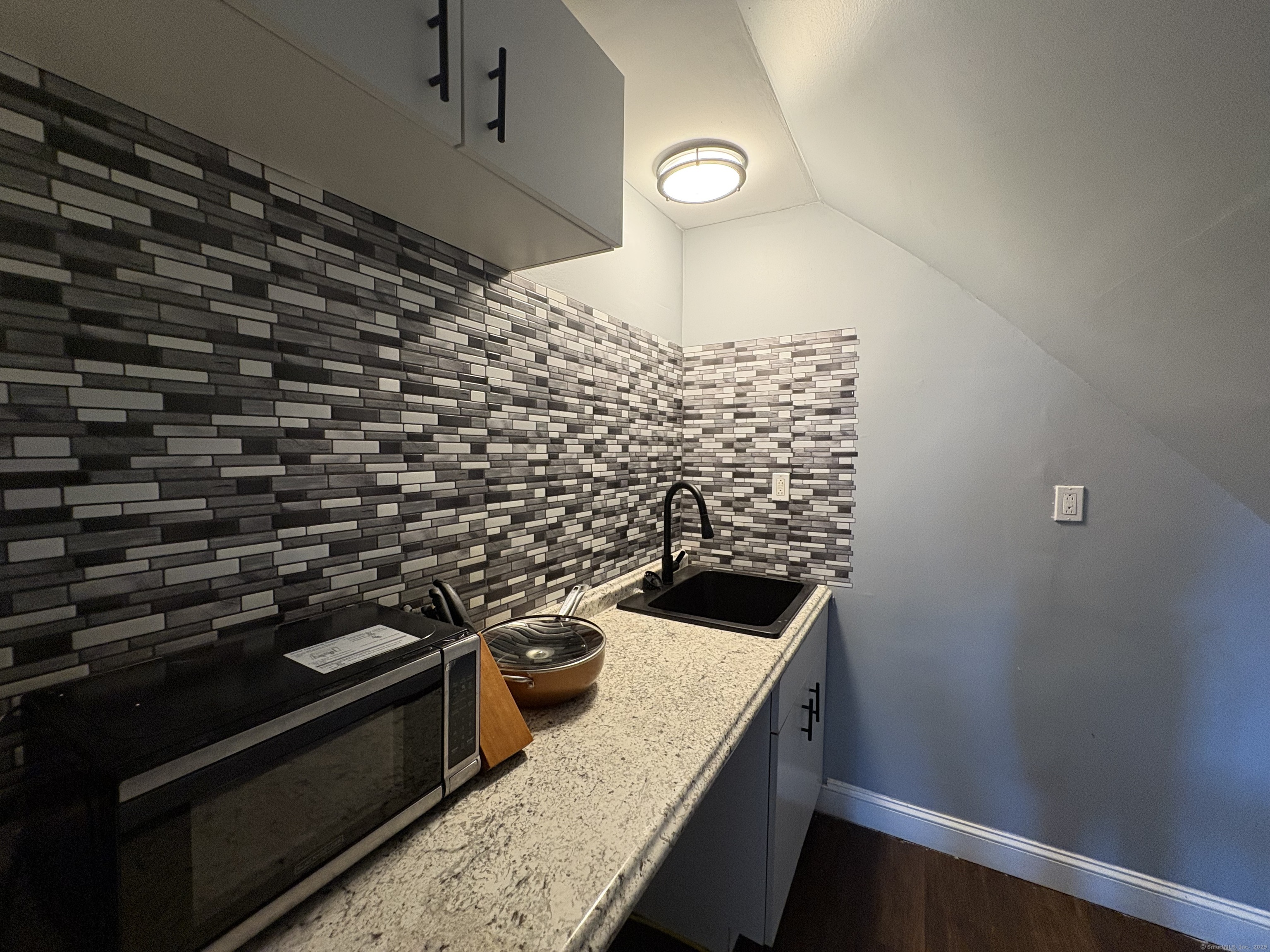 a kitchen with a stove and a sink