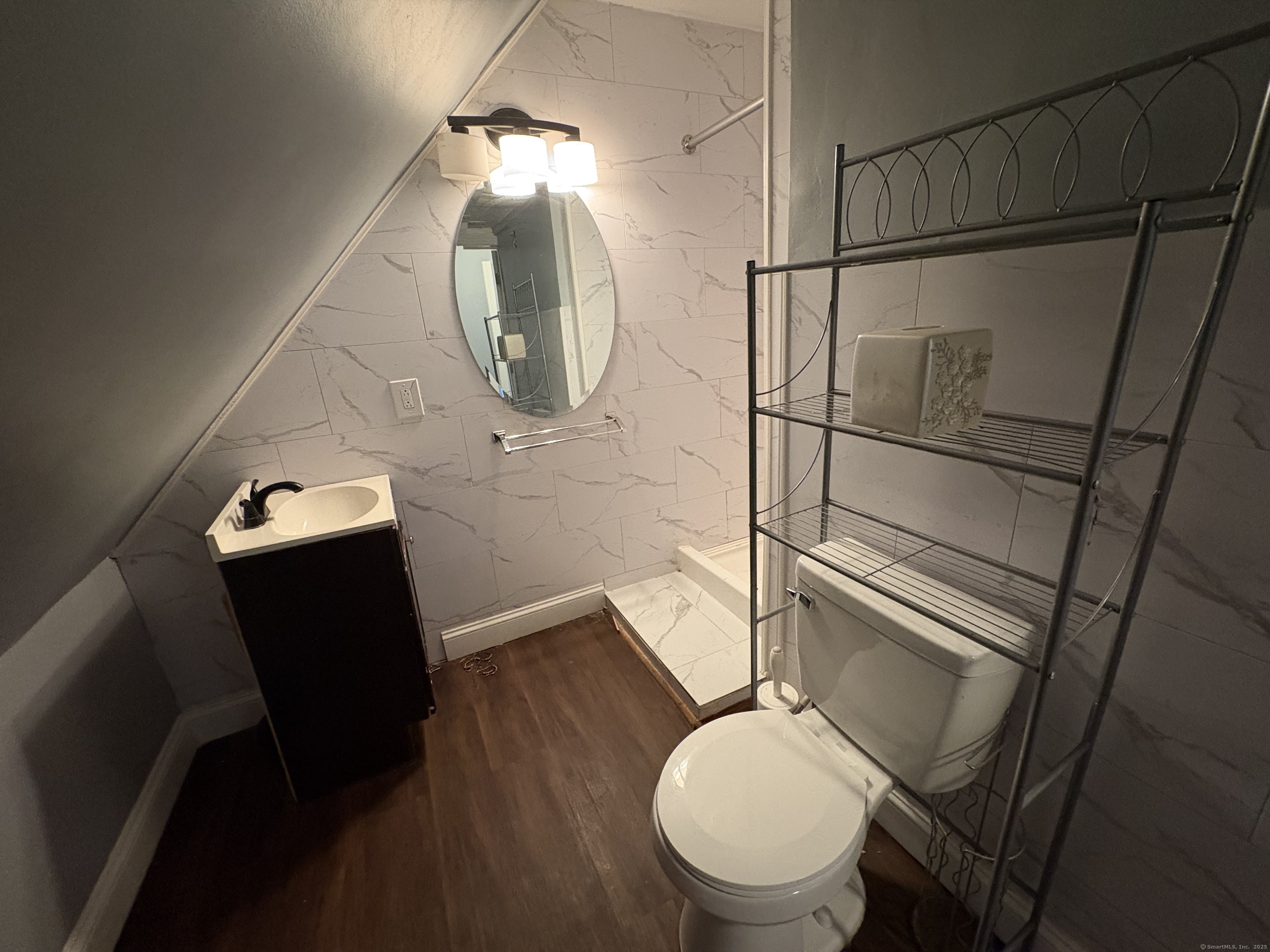 679 Shelton Street, Unit 2 Bridgeport, CT 06608 - Photo 14 of 25 a bathroom with a toilet and a mirror