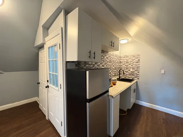a kitchen with a stove and a sink