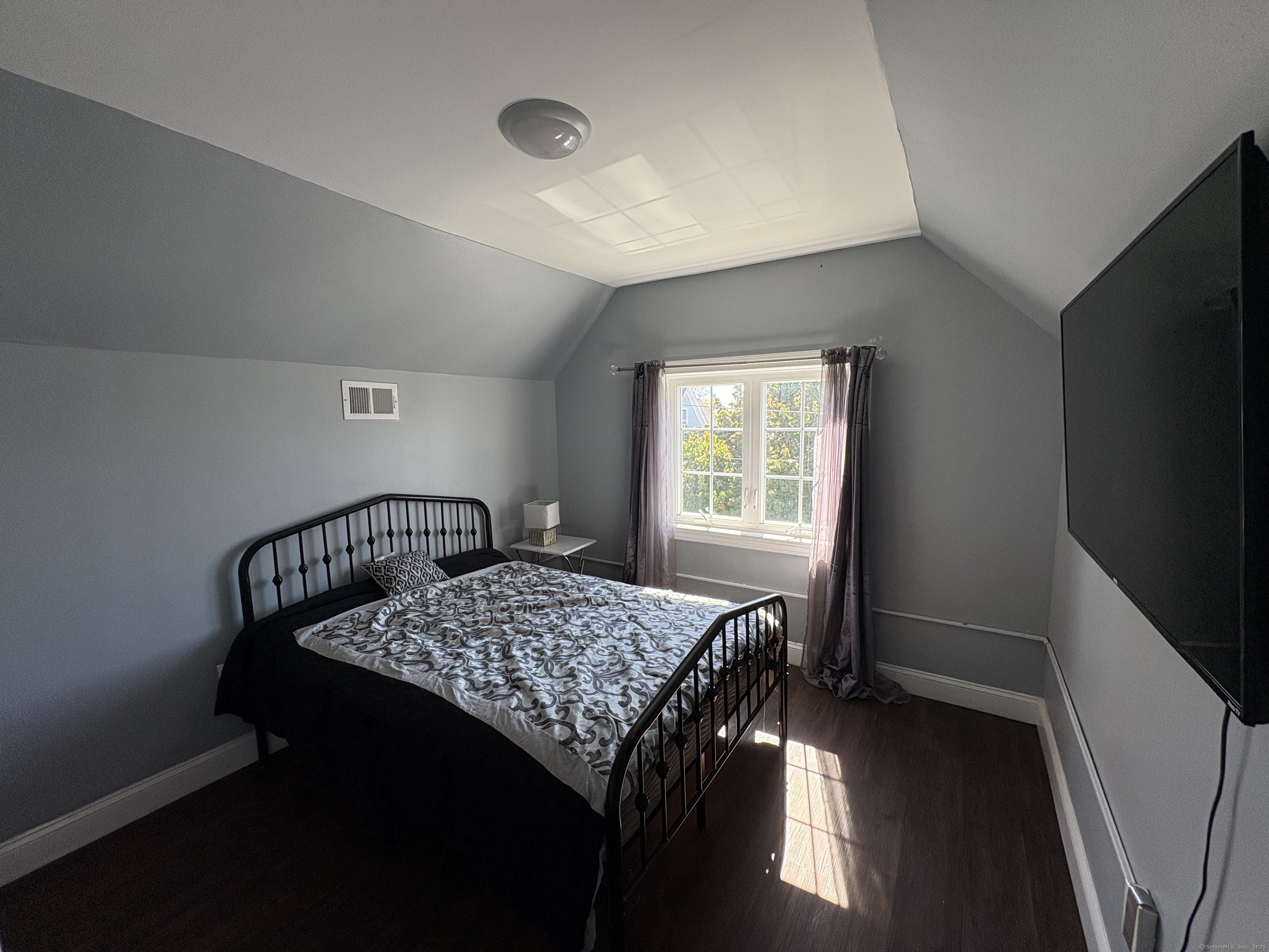 679 Shelton Street, Unit 2 Bridgeport, CT 06608 - Photo 21 of 25 a bedroom with a bed and a window