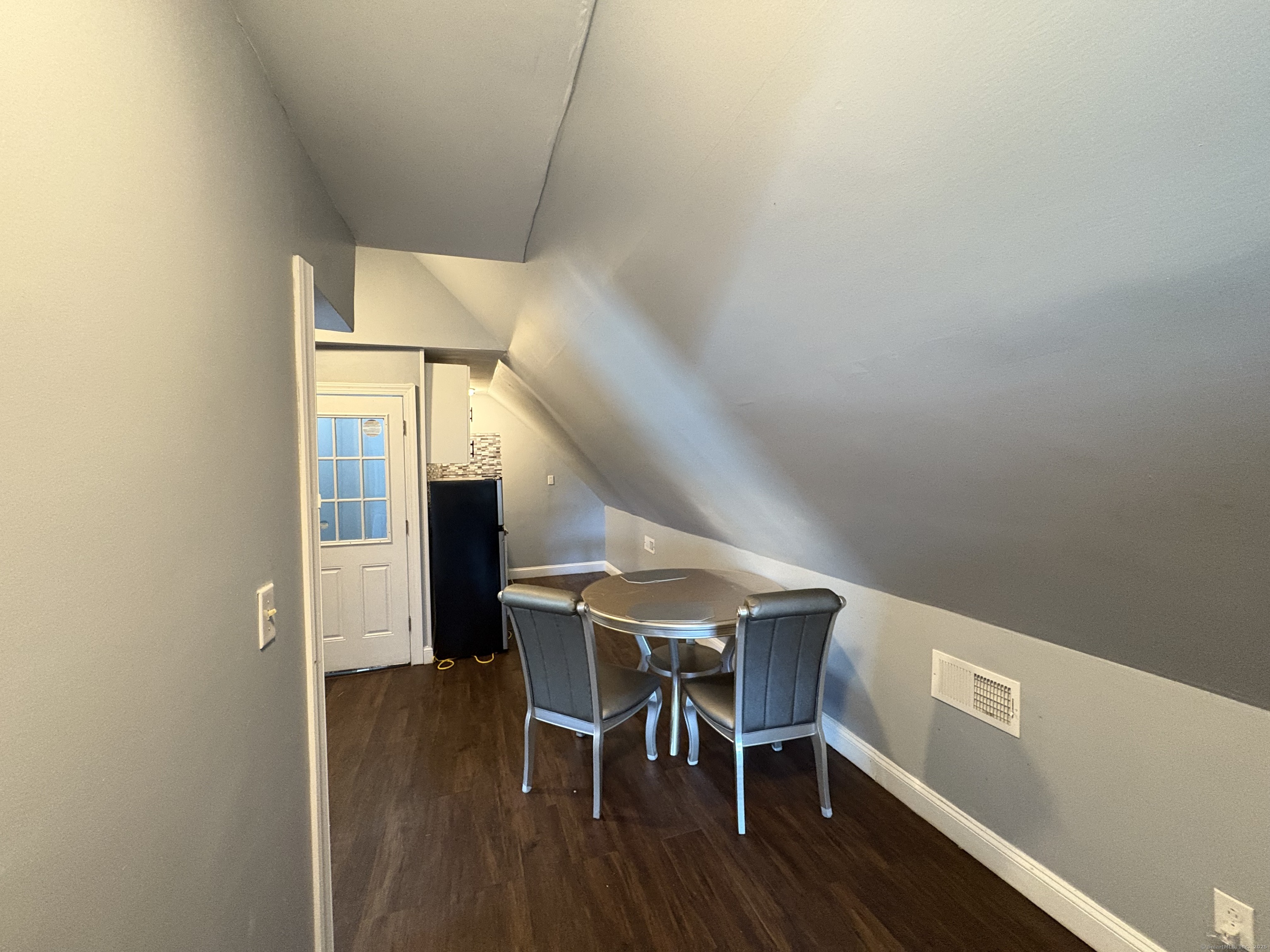 679 Shelton Street, Unit 2 Bridgeport, CT 06608 - Photo 23 of 25 a dining room with furniture and wooden floor