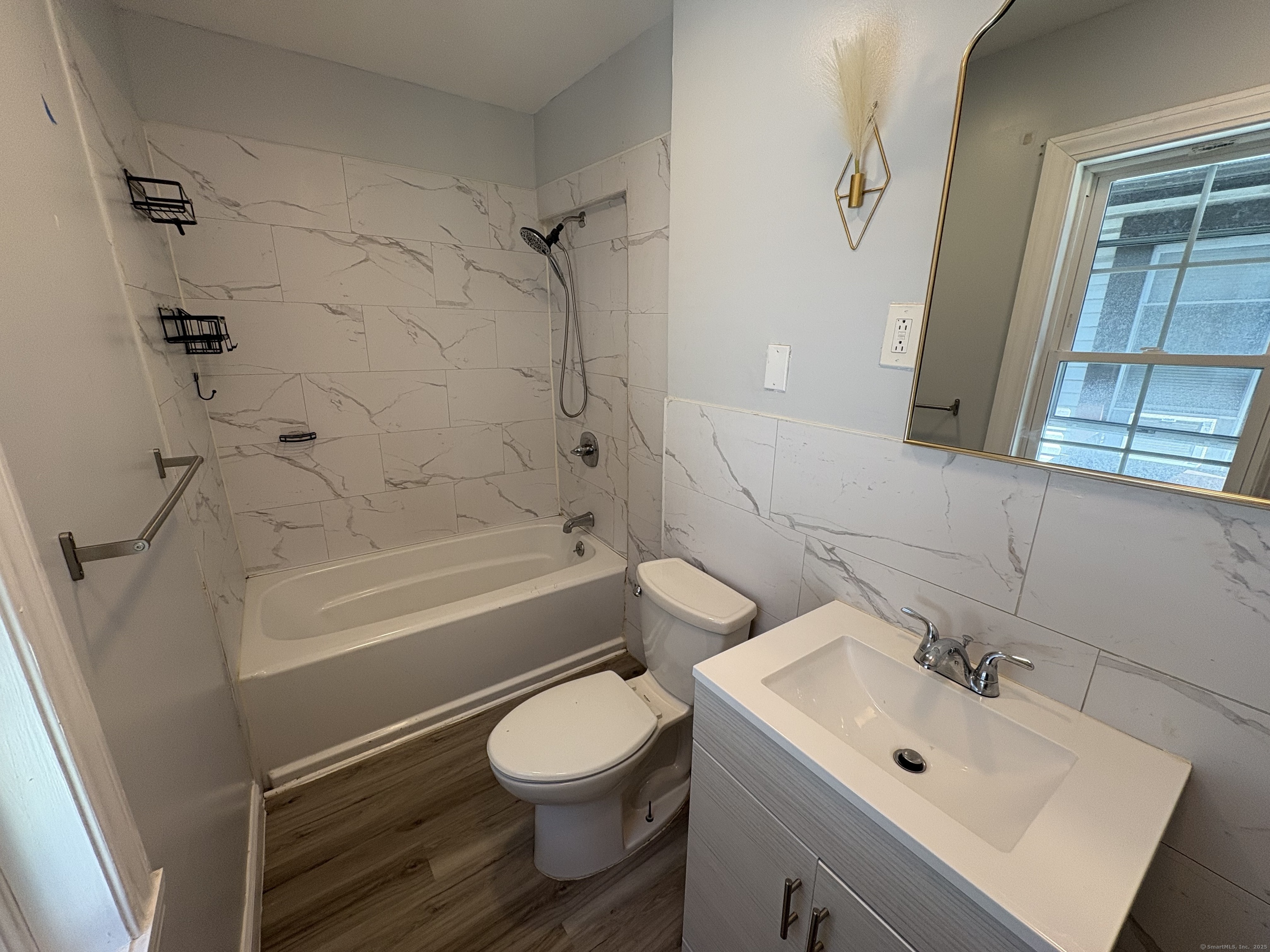 679 Shelton Street, Unit 2 Bridgeport, CT 06608 - Photo 10 of 25 a bathroom with a sink toilet and shower