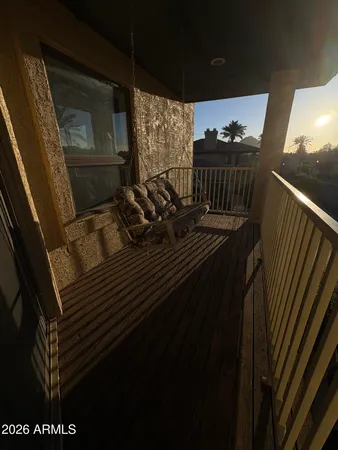 a view of balcony and wooden floor