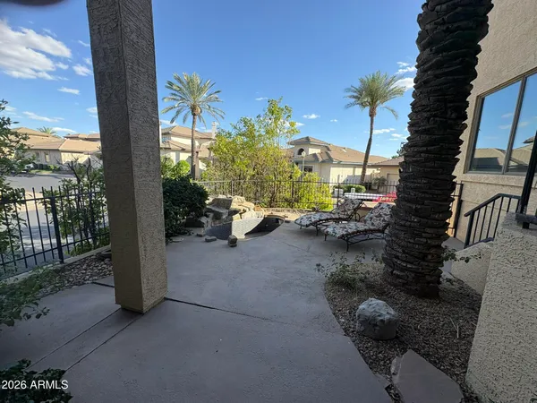 a view of backyard with patio