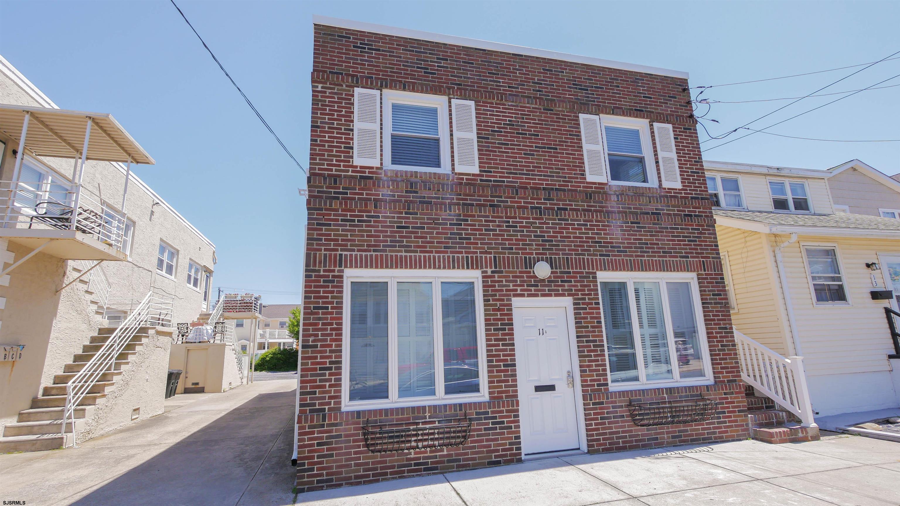 11 South Washington Avenue, Unit 2 Margate City, NJ 08402 - Photo 1 of 35 a front view of a house with a door