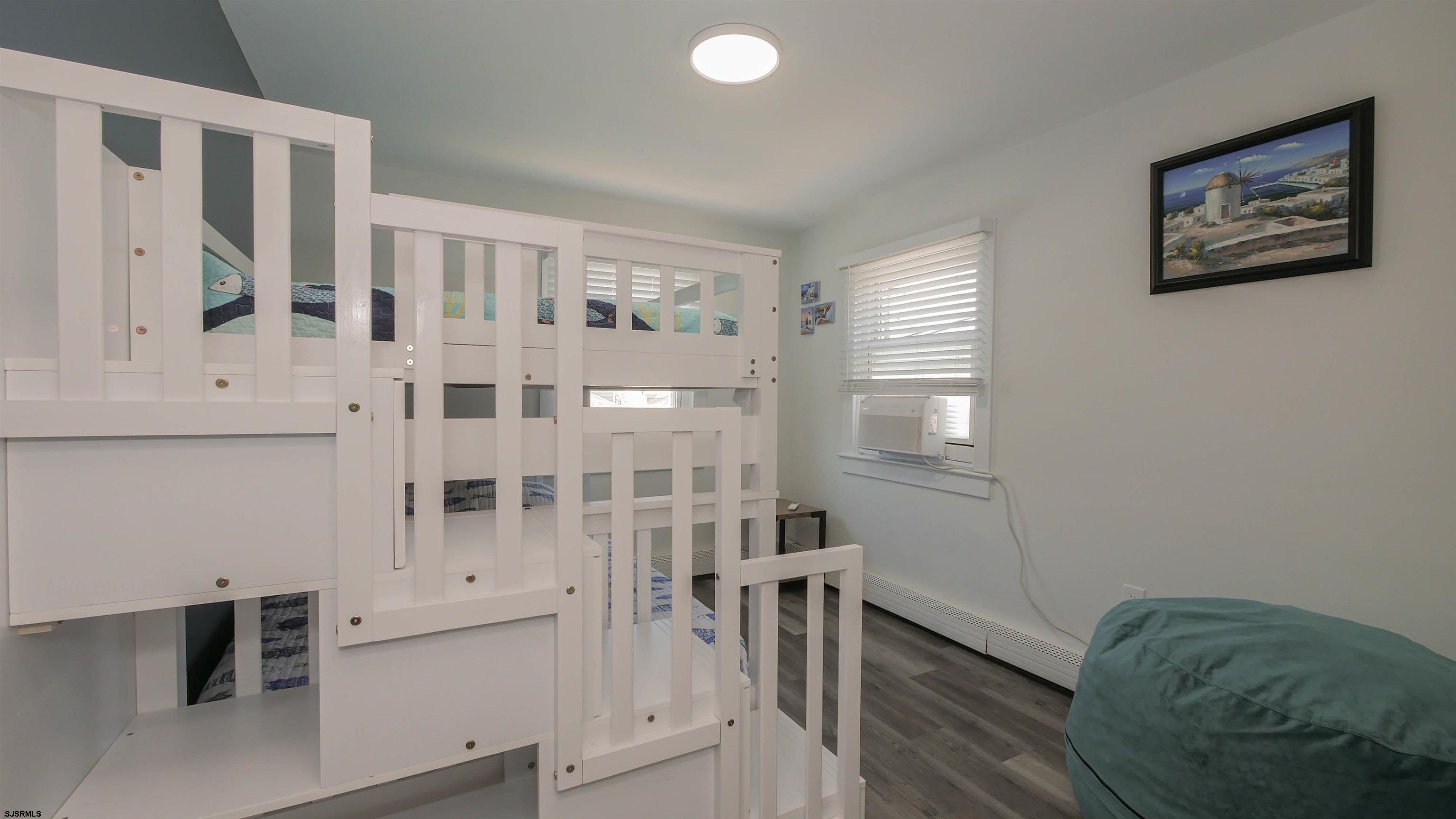 11 South Washington Avenue, Unit 2 Margate City, NJ 08402 - Photo 20 of 35 a view of a bedroom with furniture and window