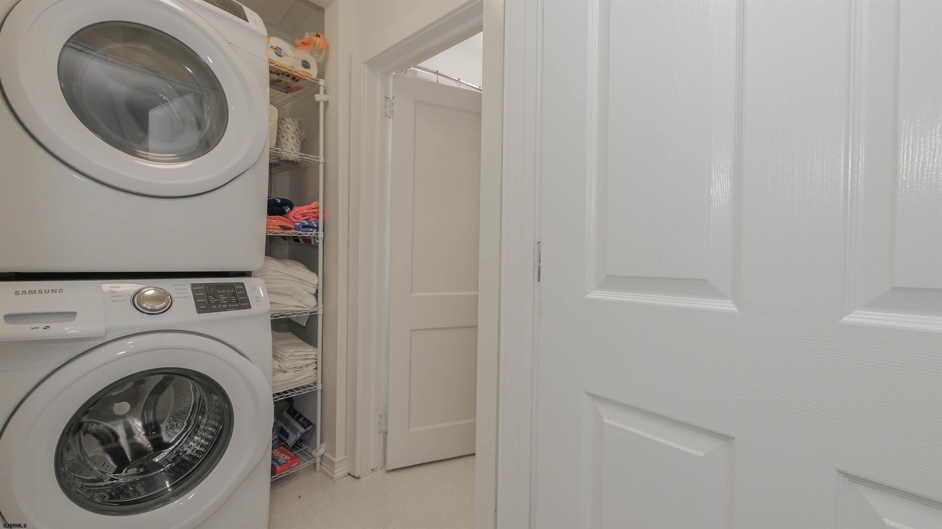 11 South Washington Avenue, Unit 2 Margate City, NJ 08402 - Photo 23 of 35 a utility room with dryer and washer