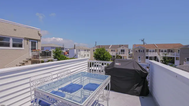a view of balcony with furniture
