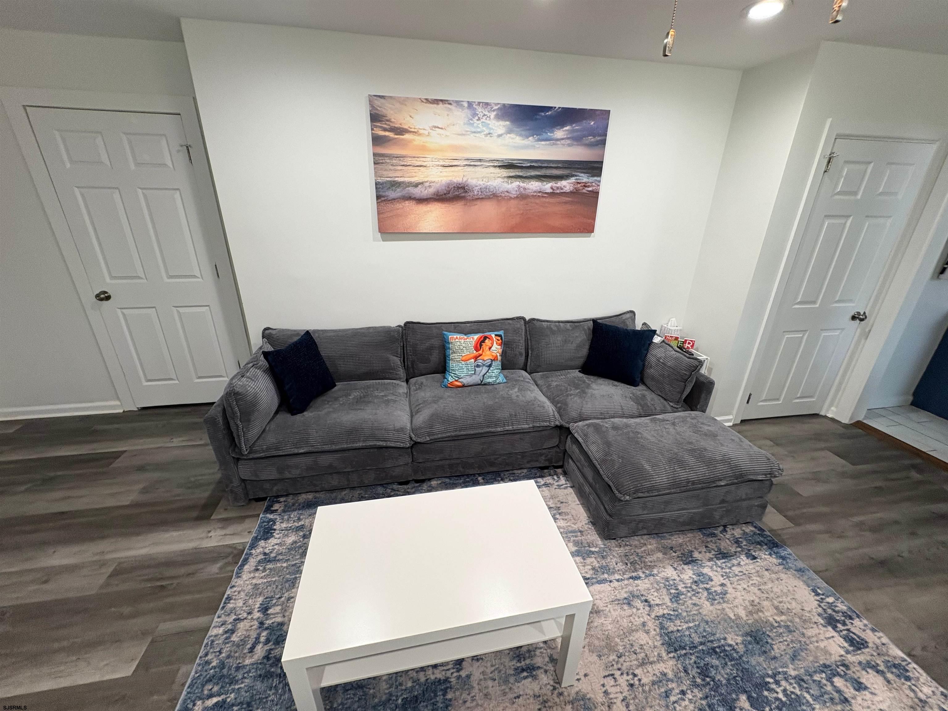 11 South Washington Avenue, Unit 2 Margate City, NJ 08402 - Photo 4 of 35 a living room with furniture and a rug
