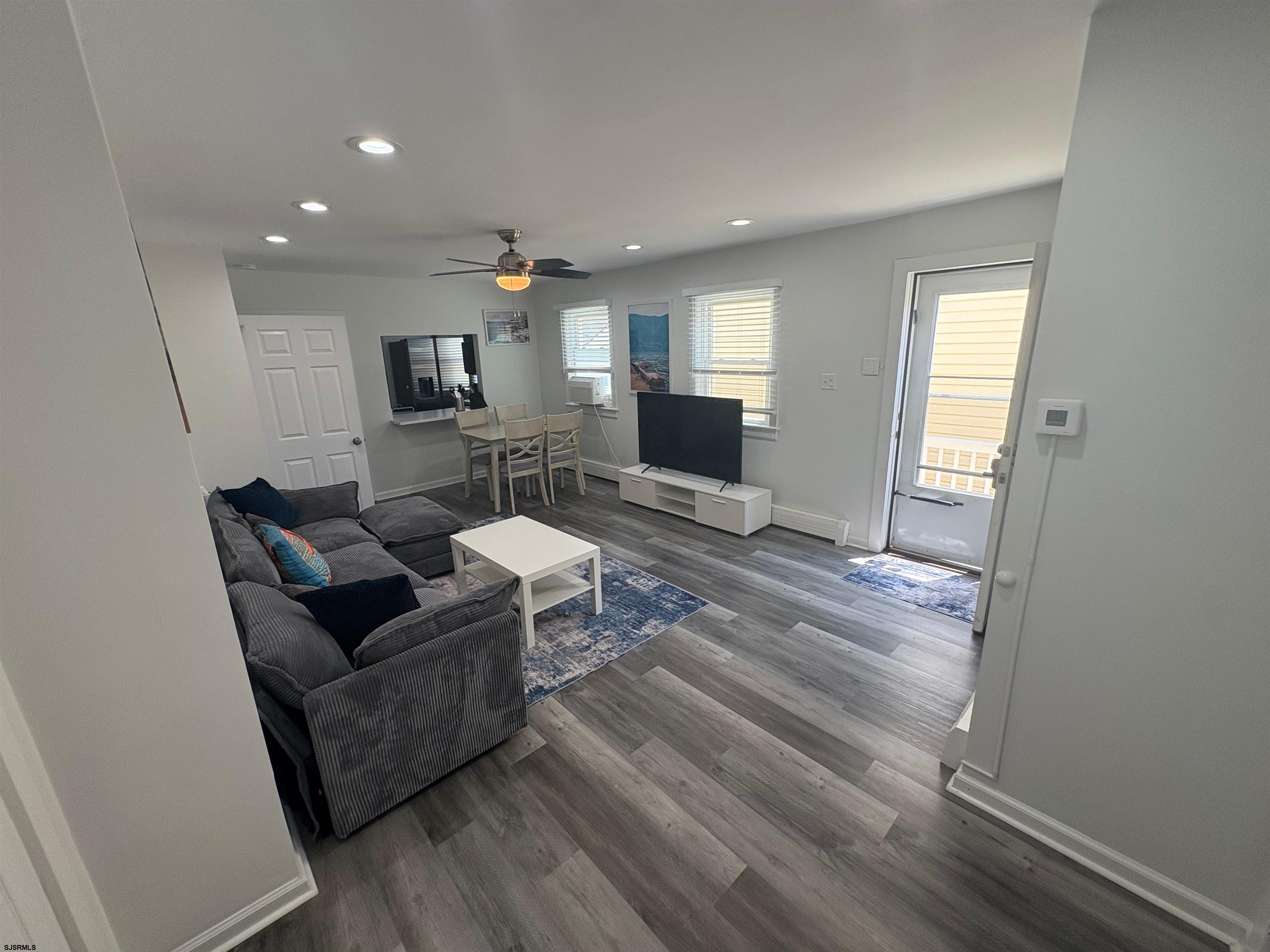 11 South Washington Avenue, Unit 2 Margate City, NJ 08402 - Photo 6 of 35 a living room with furniture and a wooden floor