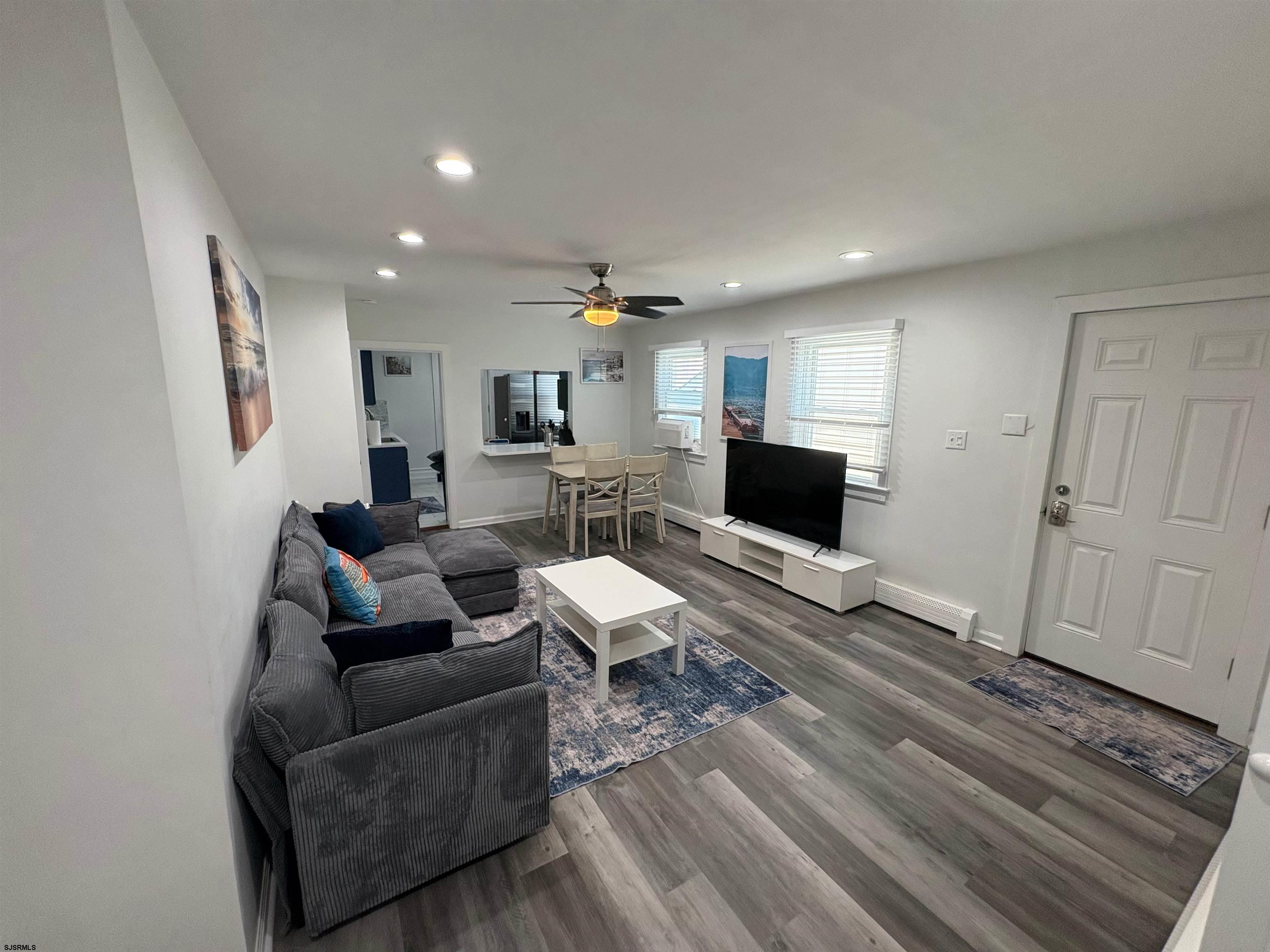 11 South Washington Avenue, Unit 2 Margate City, NJ 08402 - Photo 7 of 35 a living room with furniture and a wooden floor