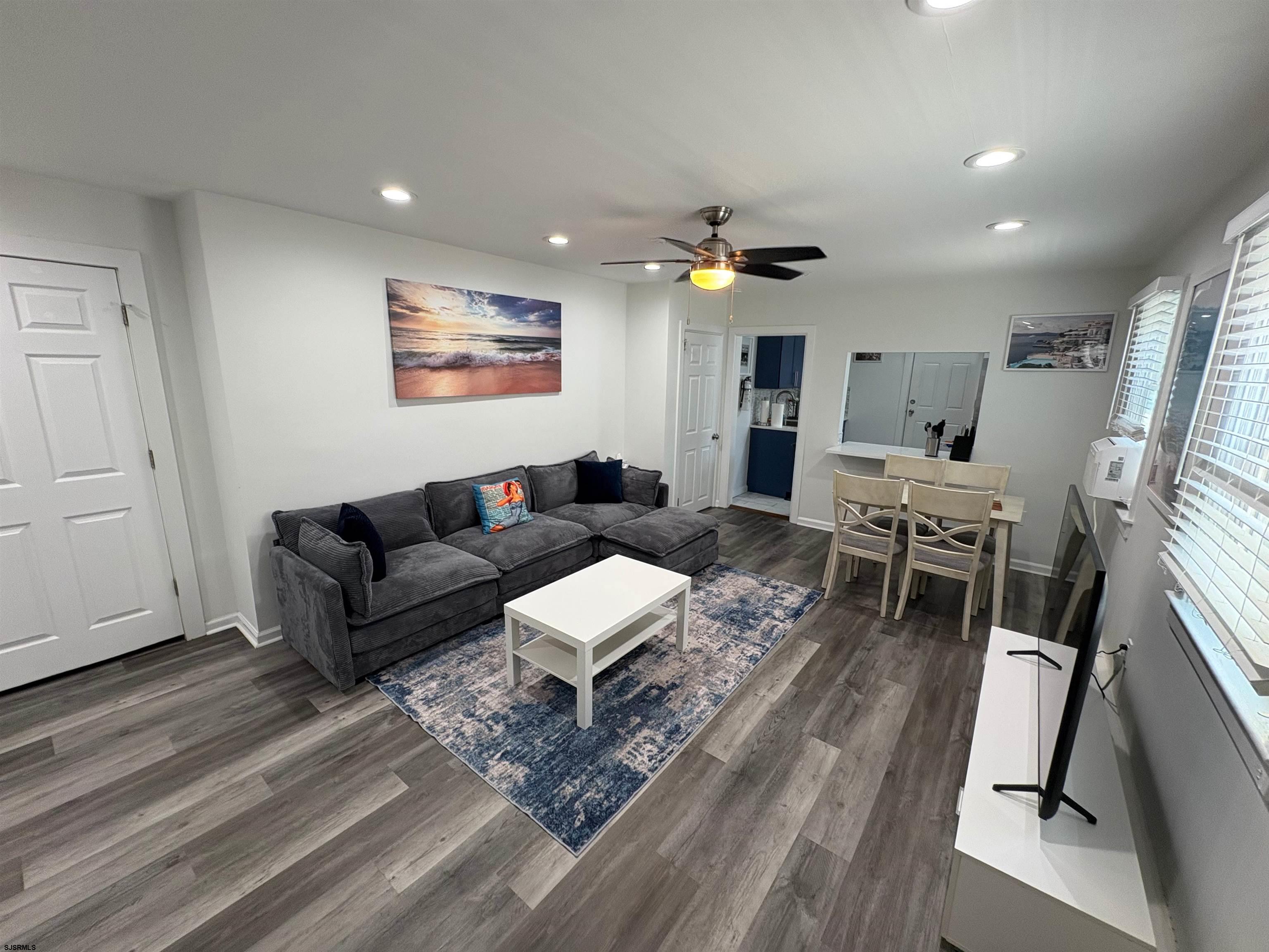 11 South Washington Avenue, Unit 2 Margate City, NJ 08402 - Photo 8 of 35 a living room with furniture and wooden floor
