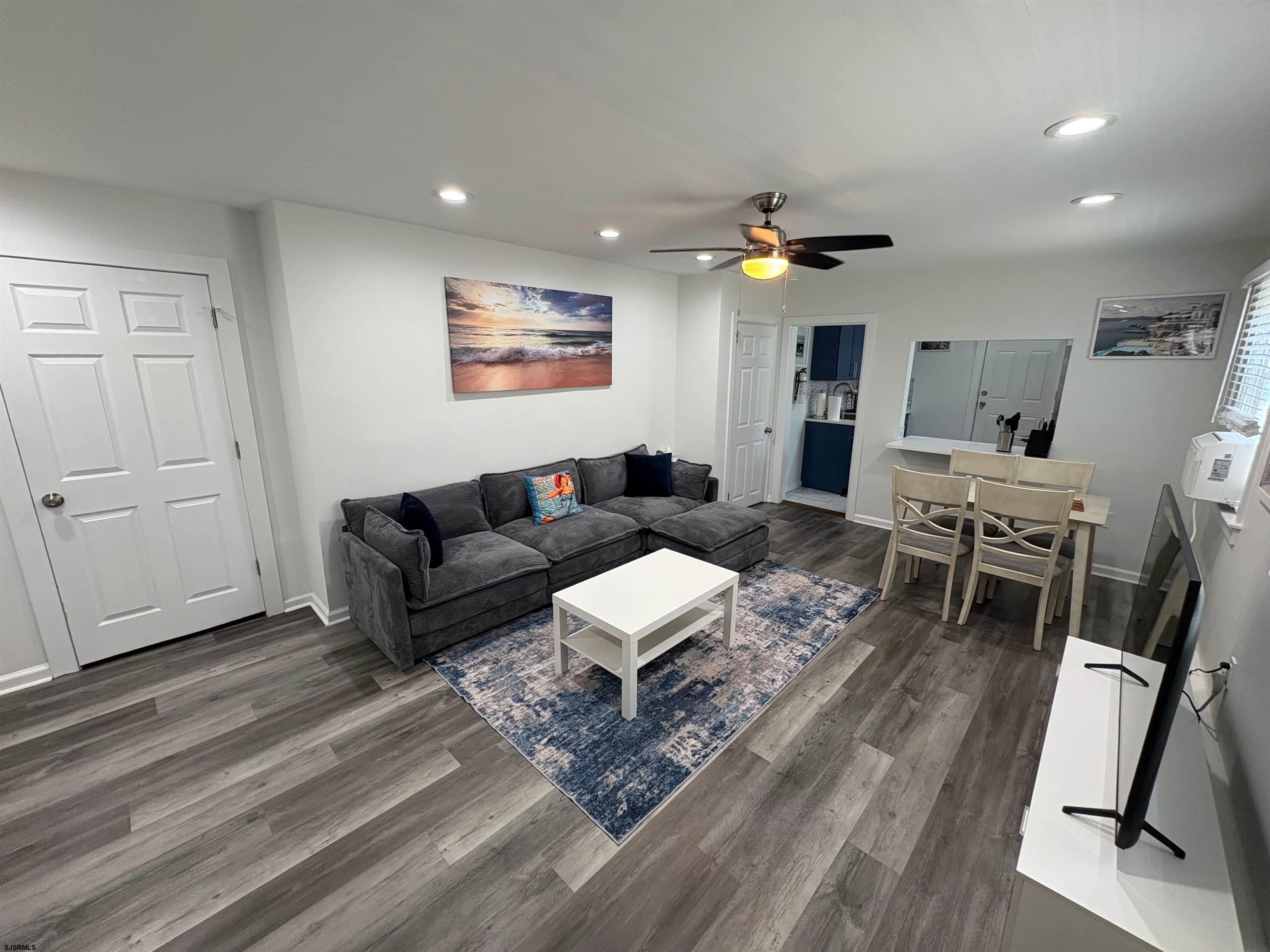 11 South Washington Avenue, Unit 2 Margate City, NJ 08402 - Photo 9 of 35 a living room with furniture and wooden floor