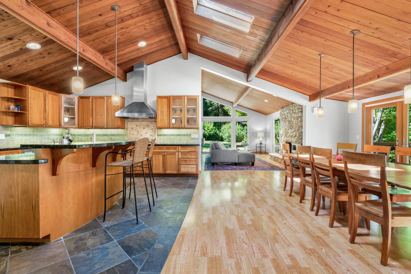 111 Carter Road Santa Cruz, CA 95060 - Photo 16 of 64 a dining room with stainless steel appliances granite countertop lots of wooden furniture