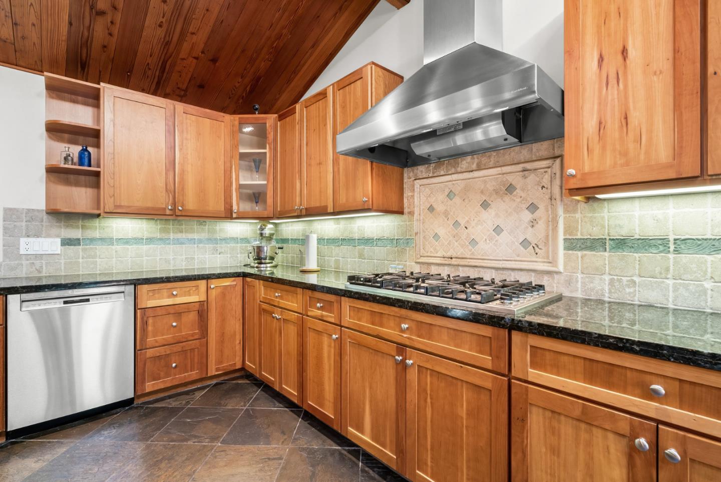 111 Carter Road Santa Cruz, CA 95060 - Photo 19 of 64 a kitchen with stainless steel appliances granite countertop wooden cabinets and a stove top oven