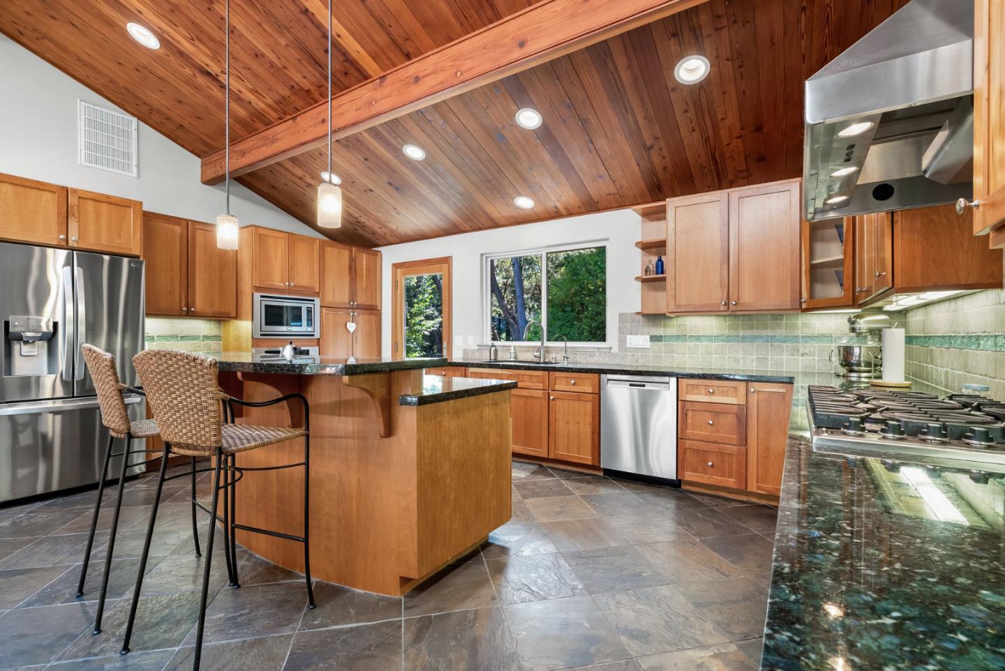 111 Carter Road Santa Cruz, CA 95060 - Photo 22 of 64 a kitchen with stainless steel appliances granite countertop a stove refrigerator sink and cabinets