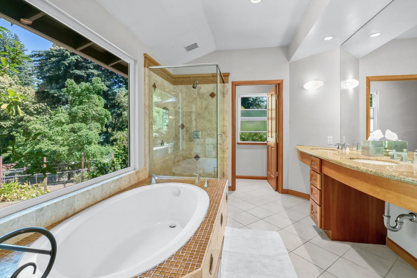 111 Carter Road Santa Cruz, CA 95060 - Photo 28 of 64 a bathroom with a granite countertop bathtub a sink and a large window