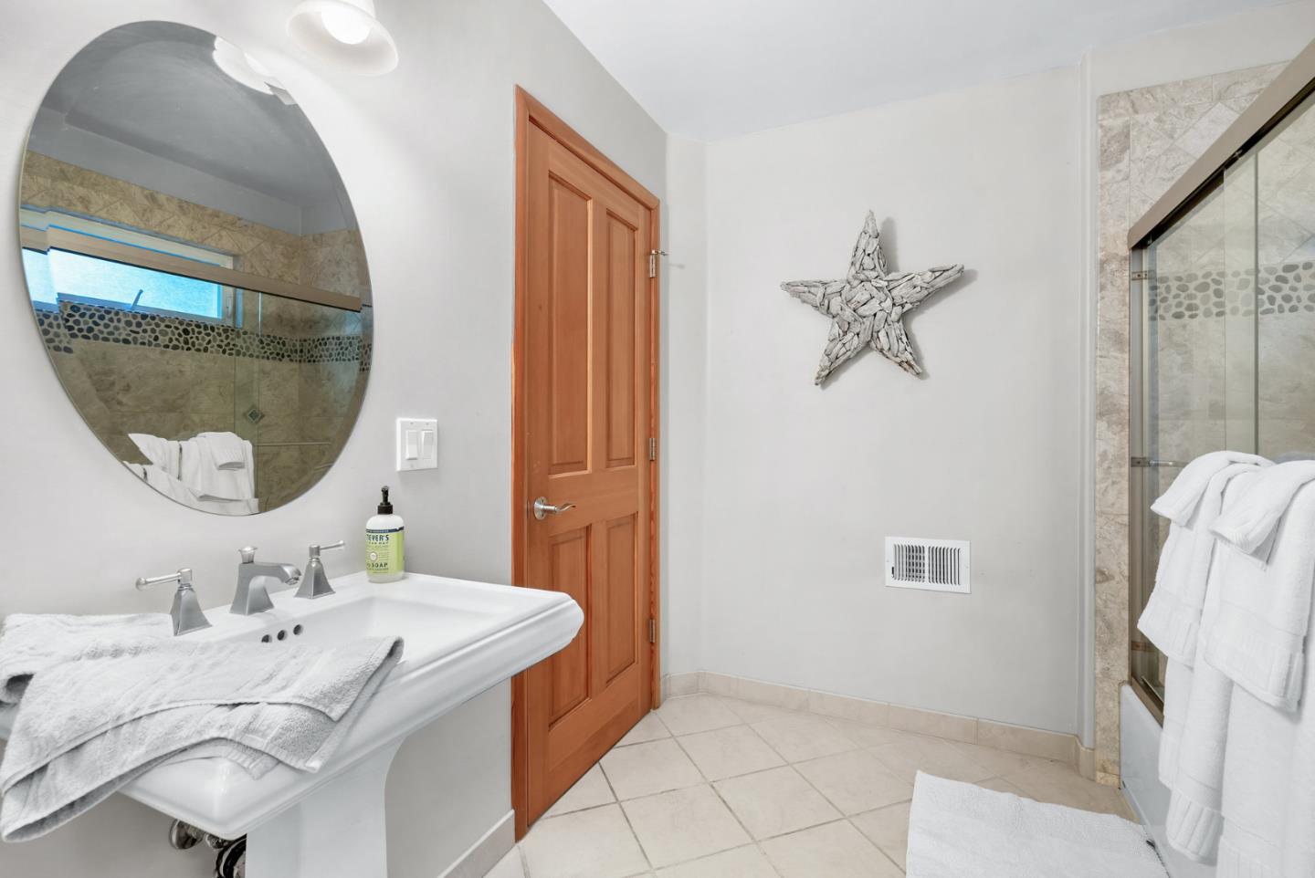 111 Carter Road Santa Cruz, CA 95060 - Photo 32 of 64 a bathroom with a sink and a mirror