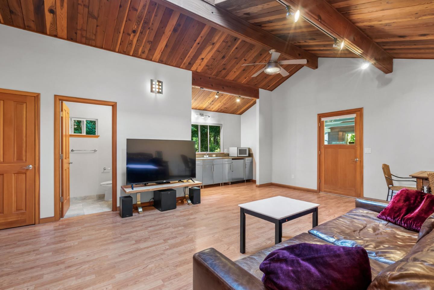 111 Carter Road Santa Cruz, CA 95060 - Photo 33 of 64 a living room with furniture and a flat screen tv