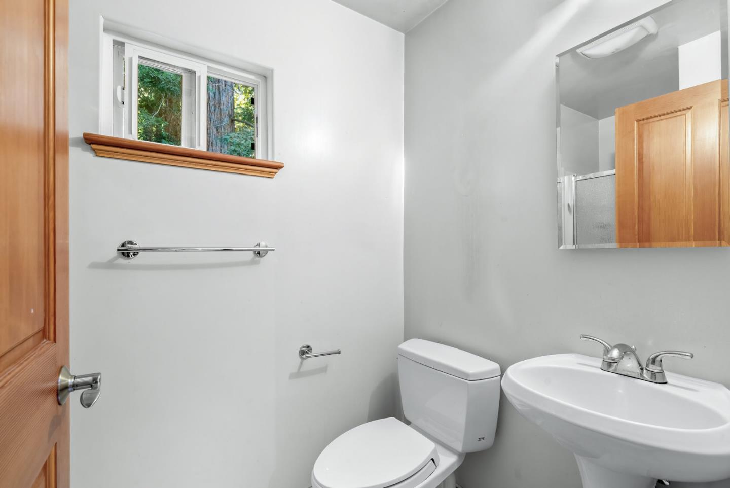 111 Carter Road Santa Cruz, CA 95060 - Photo 37 of 64 a bathroom with a toilet a sink and mirror