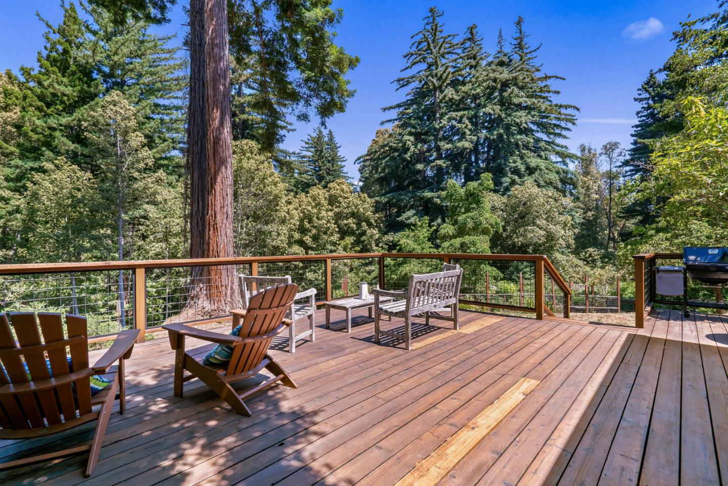 111 Carter Road Santa Cruz, CA 95060 - Photo 46 of 64 a view of a deck with chairs a barbeque with wooden floor and fence
