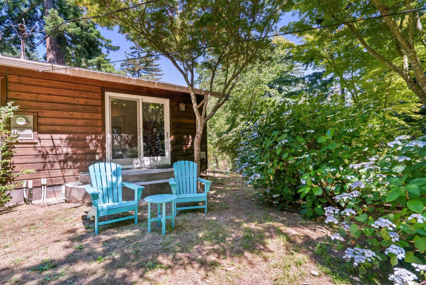111 Carter Road Santa Cruz, CA 95060 - Photo 51 of 64 a view of a chair and table in backyard of the house