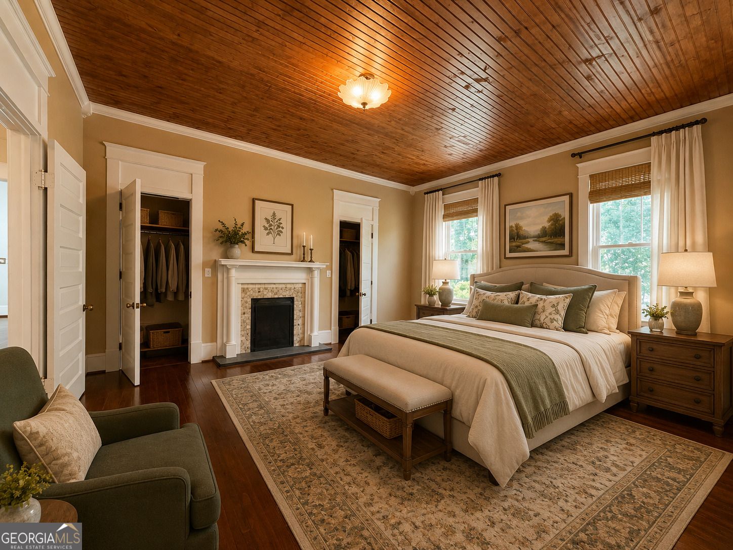 316 West Church Street Fort Valley, GA 31030 - Photo 10 of 28 a spacious bedroom with a large bed couch and a fireplace
