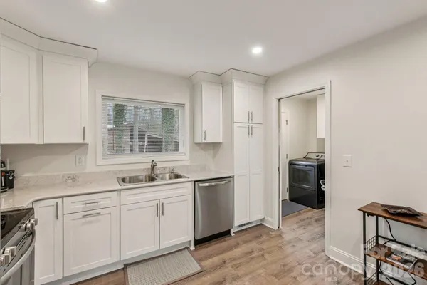 a kitchen with a sink and cabinets
