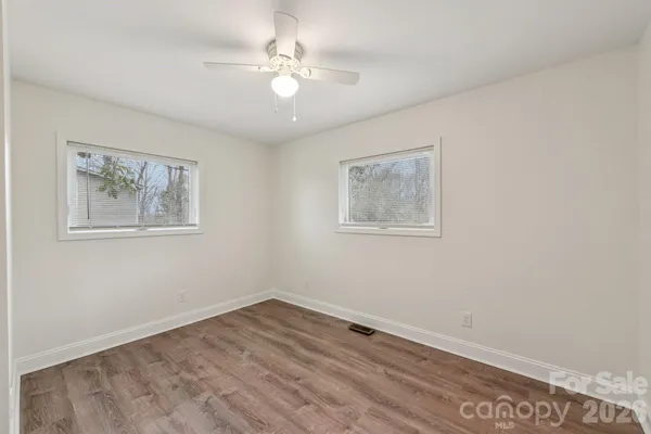 a view of room with window and ceiling fan