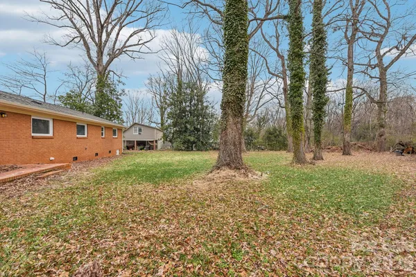 a backyard of a house with lots of green space