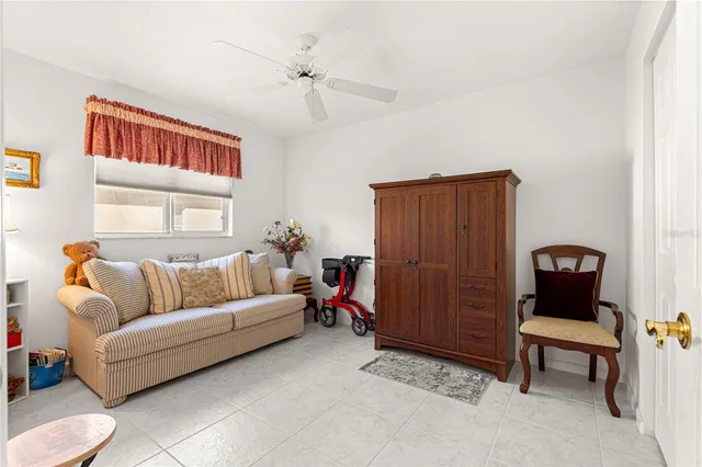 a view of a livingroom and a chandelier fan