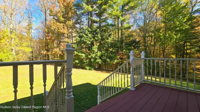 a view of balcony with wooden floor