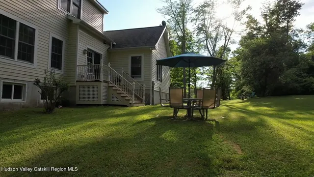 a bench sitting in the middle of a yard